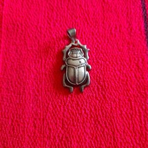 An Egyptian Silver scarab